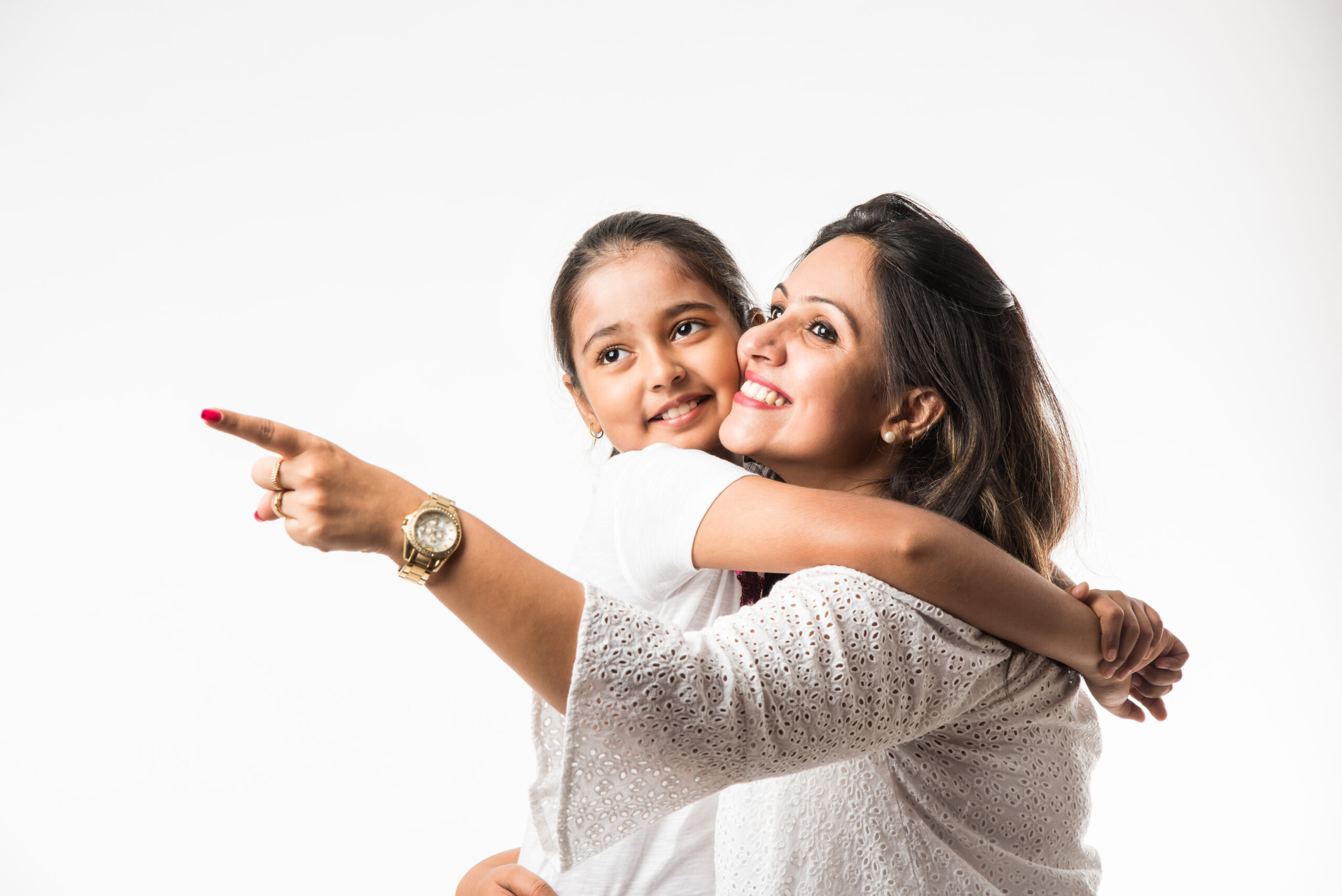 Indian mother daughter on white background hugging, kissing, riding, flying, pointing, presenting over white background